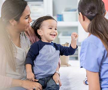 Child with mom visiting medical provider