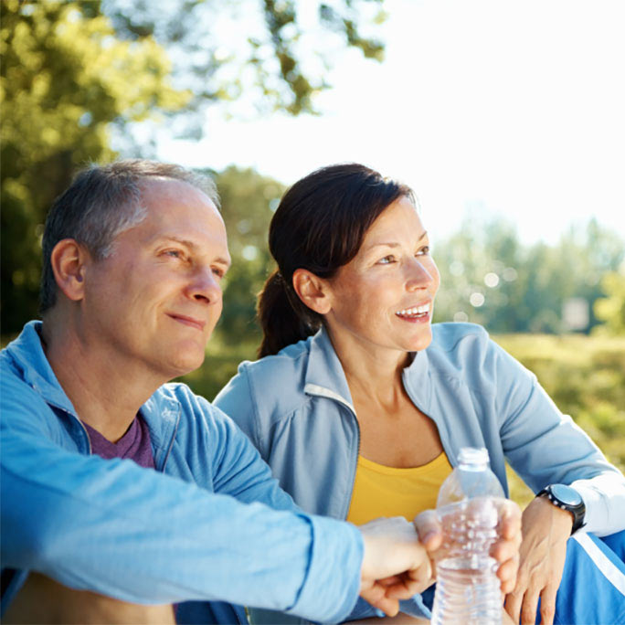 Active couple sitting outdoors