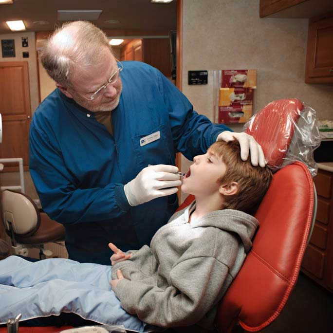 dentist working on a young boy