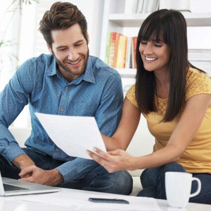 young couple looking at paperwork