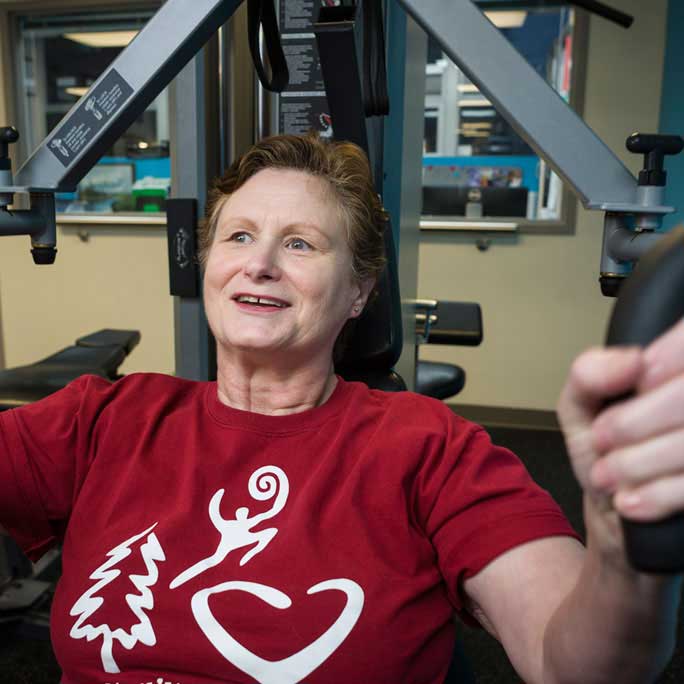 Patient doing chest presses as part of Cardiac Rehabilitation.
