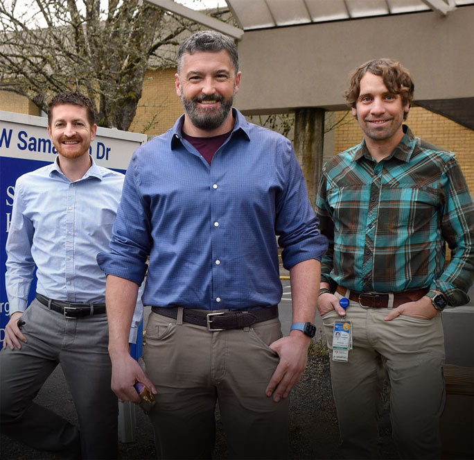 The cardiology fellows directors in front of their Corvallis location. Doctors Earley, Hudson and Warner.