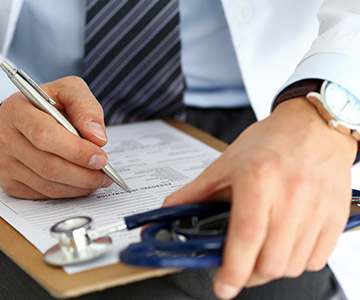 Doctor completing form