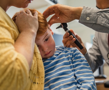 Young boy with an ear infection.