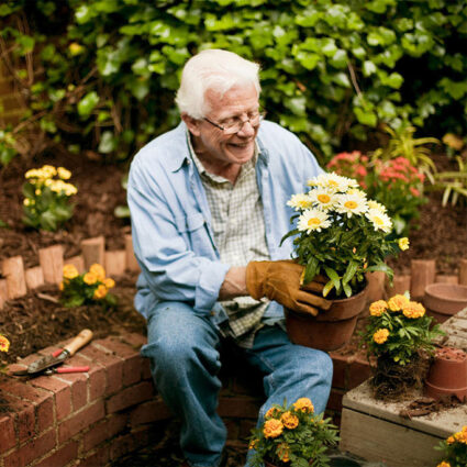 Elderly man gardening.