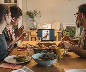 Family having a virtual dinner together.