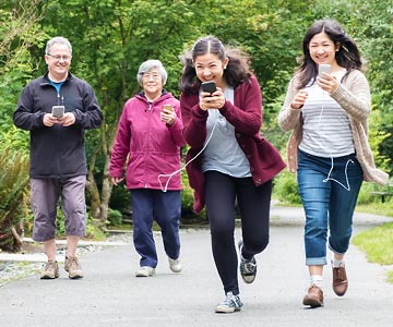 A family out for a walk together and smiling