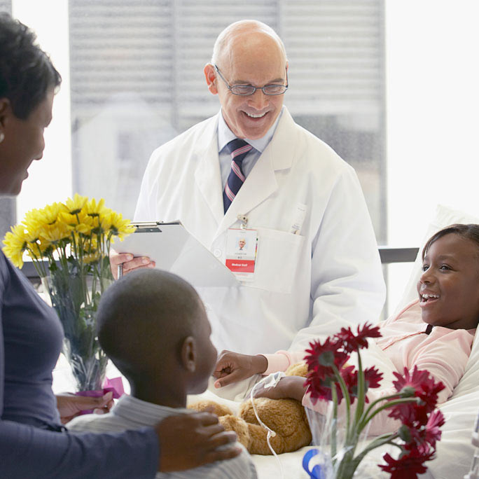 doctor with daughter and family in hospital