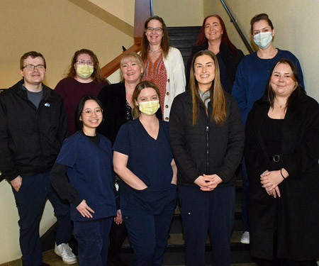 Staff from Samaritan Gastroenterology in Corvallis pose for a picture on the stairs in their office.
