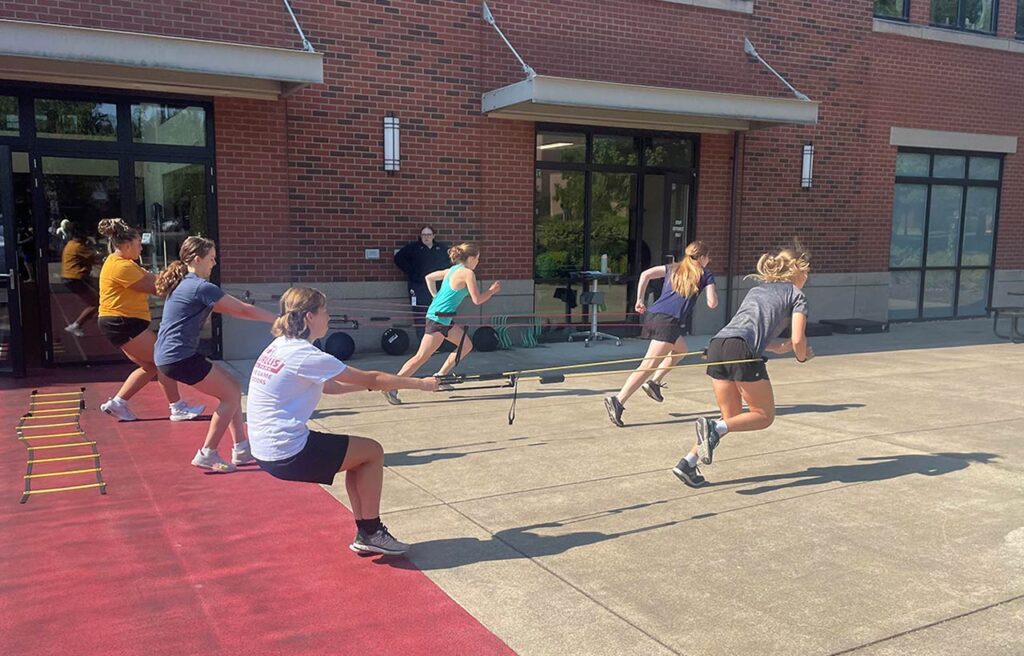 Girls working on performance enhancement at Girl's Strength Camp held each summer at The SAM.
