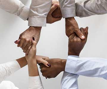 Group of diverse hands holding each other