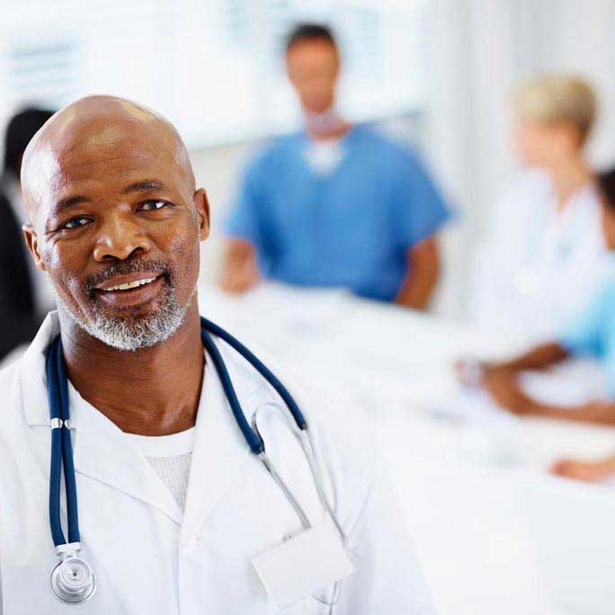 Handsome doctor with staff
