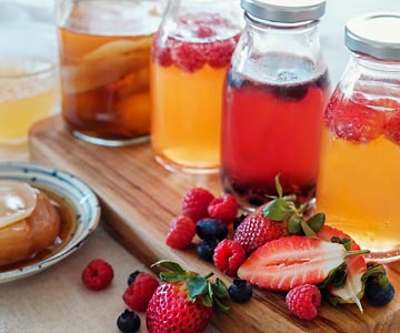 Colorful jars of kombucha fermented teas.