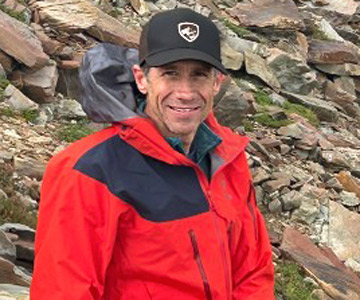 Dr. Lon McQuillan resting during a hike
