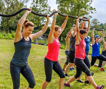 People exercising on lawn outside