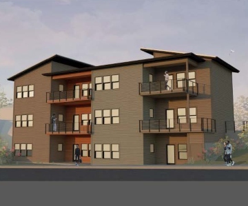 Image of three story apartment building with balconies