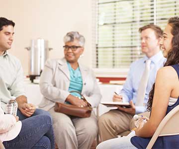 people meeting in support group