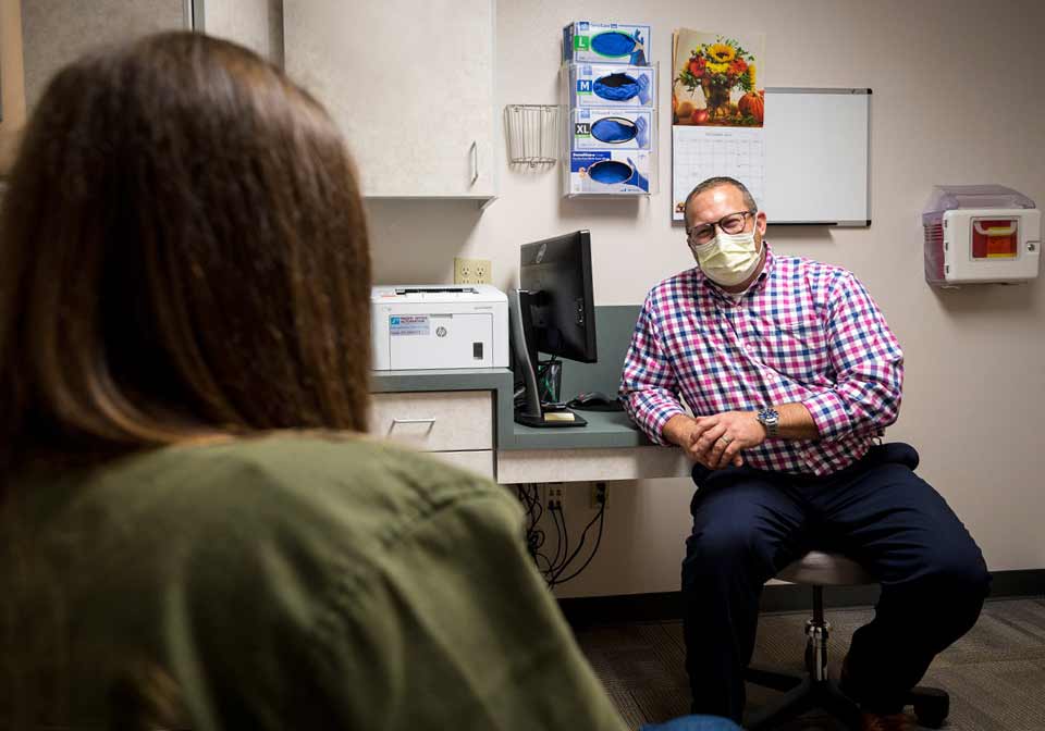 Ashley talking with her doctor.