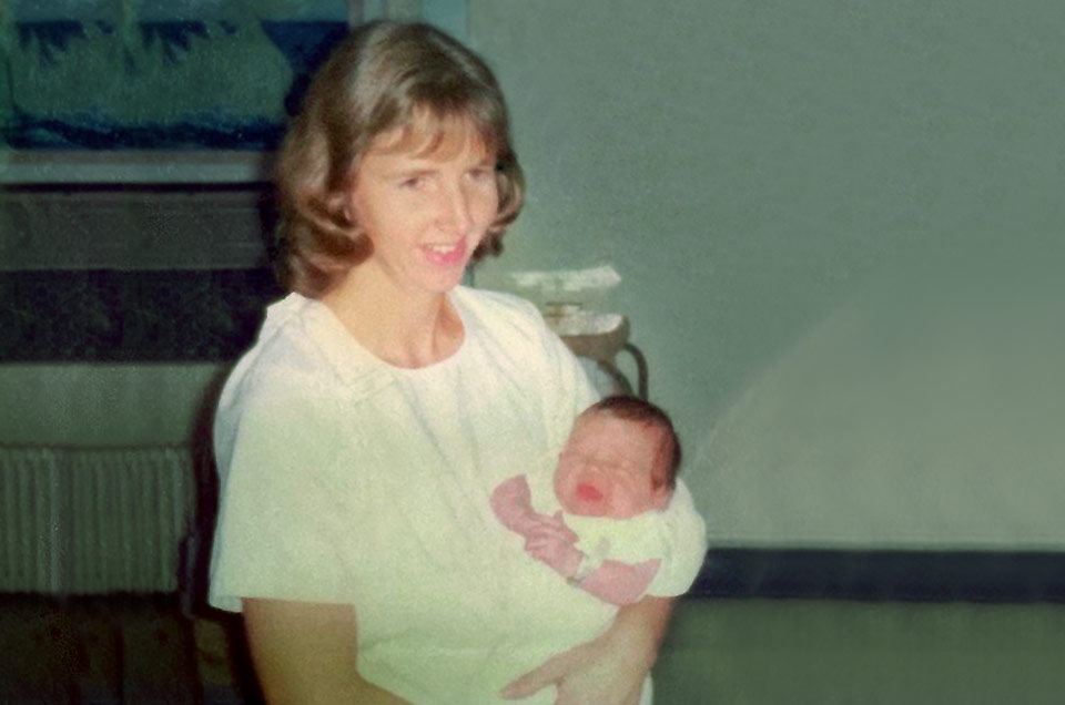 Carol caring for an infant early in her career.