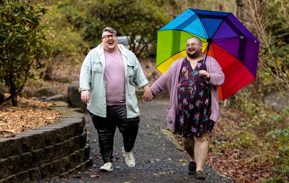 Castiel and Elijah share a laugh as they walk through a local park.