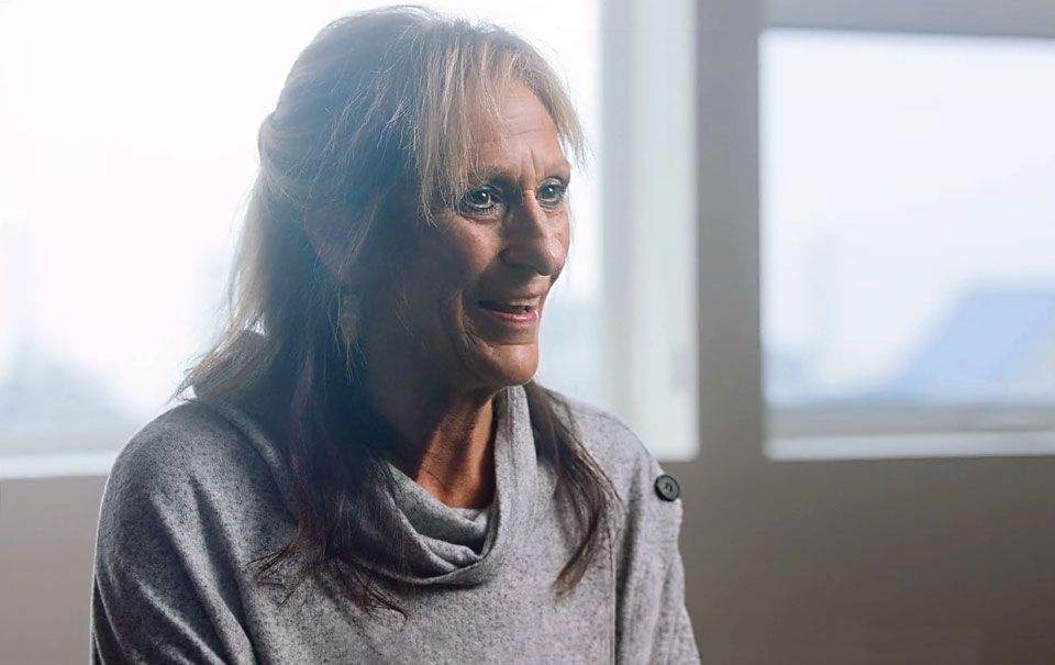 Cyndee sharing her story. Smiling close up.