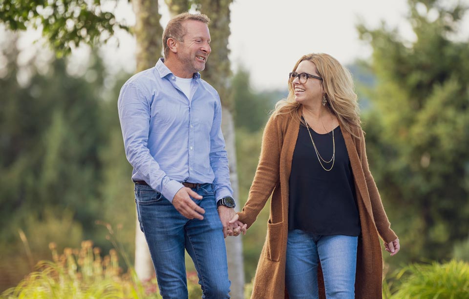 Kent and his wife waling together hand in hand.