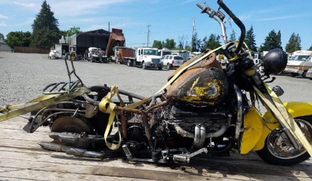 Kent's burned out motorcycle after the crash.
