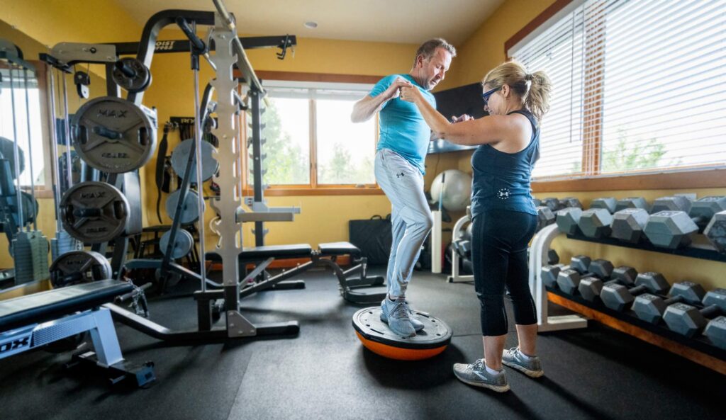 Kent's wife helping his with rehab exercises.