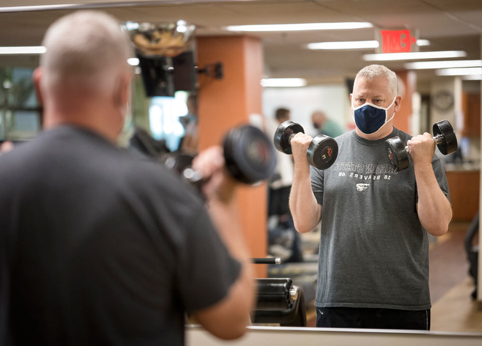 Matt lifting weights to regain strength after his long hospital stay.