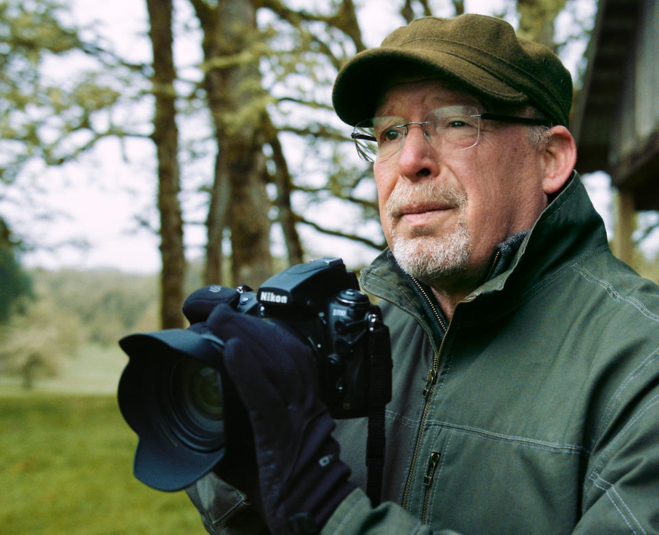 Randall with his Nikon camera enjoys photography in his free time.