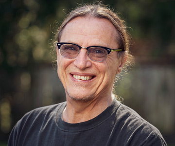 A close up of Rik smiling. Rik Savering