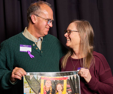 Rob and Donna Durbin smiling at one another at the annual Cancer Survivor's Day event.