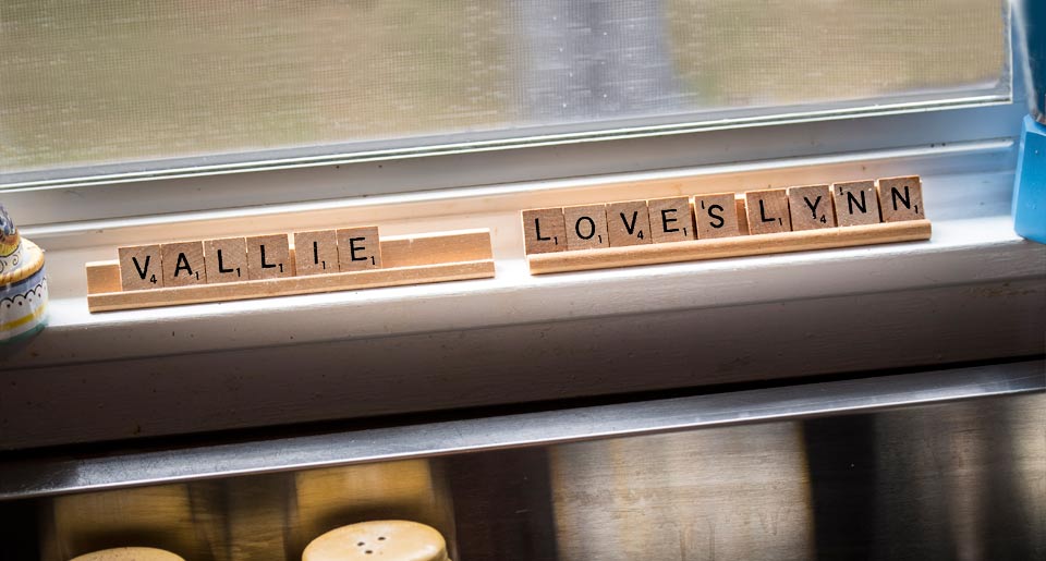 Scrabble pieces that spell "Vallie Loves Lynn."