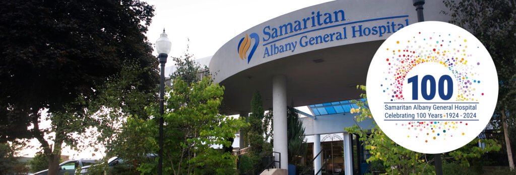 Front entry of Samaritan Albany General Hospital with 100 year anniversary logo.