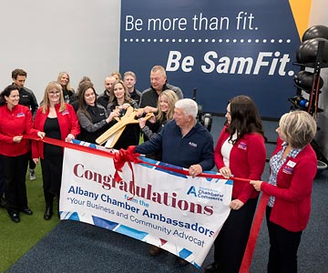 Samaritan employees and local community members cut the ribbon to the newly reopened SamFit-Albany. May 2024.