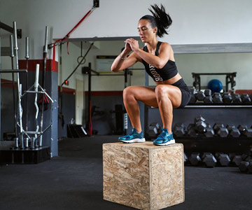 woman exercising on top of block sports medicine
