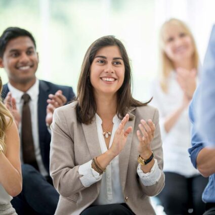 Young adults clapping